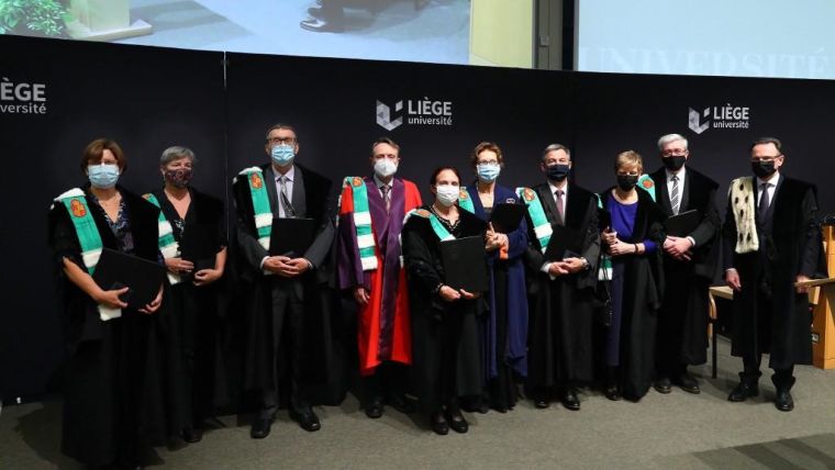 Photo of 10 award recipients wearing black robes including Dorothy Bishop.