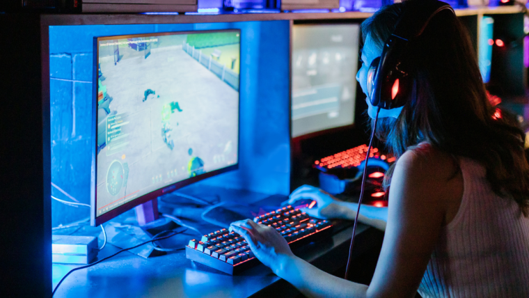 Photo of adolescent girl gaming in front of a computer